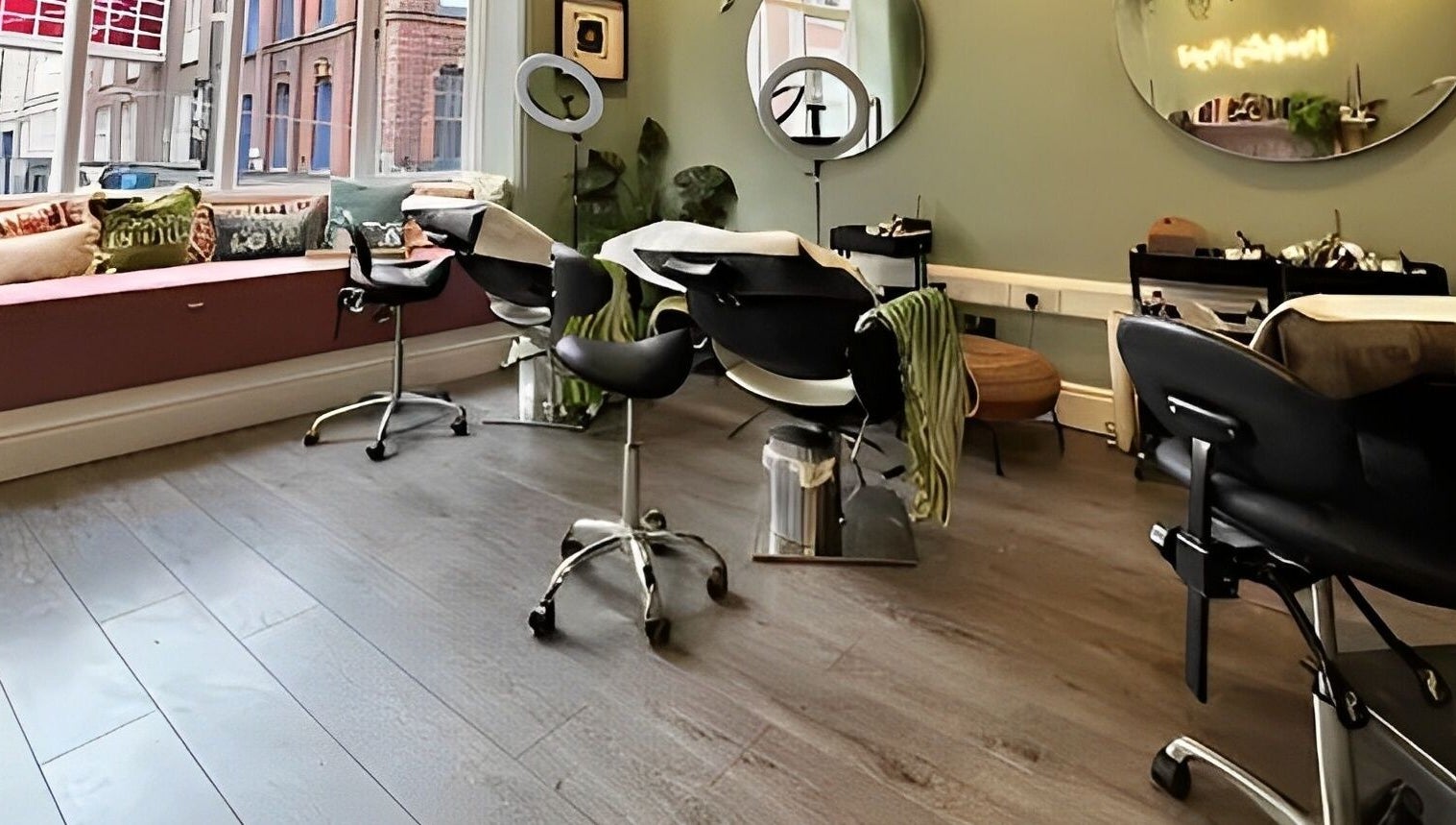 Modern salon interior at Alchemy Lab, Dublin, Dublin, IE with chic styling chairs and large mirrors.