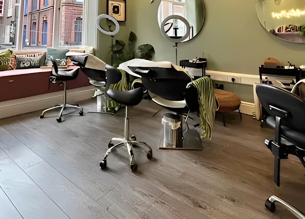 Modern salon interior at Alchemy Lab, Dublin, Dublin, IE with chic styling chairs and large mirrors.