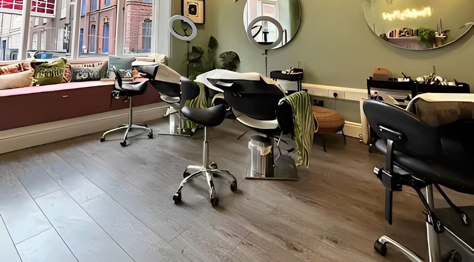Modern salon interior at Alchemy Lab, Dublin, Dublin, IE with chic styling chairs and large mirrors.