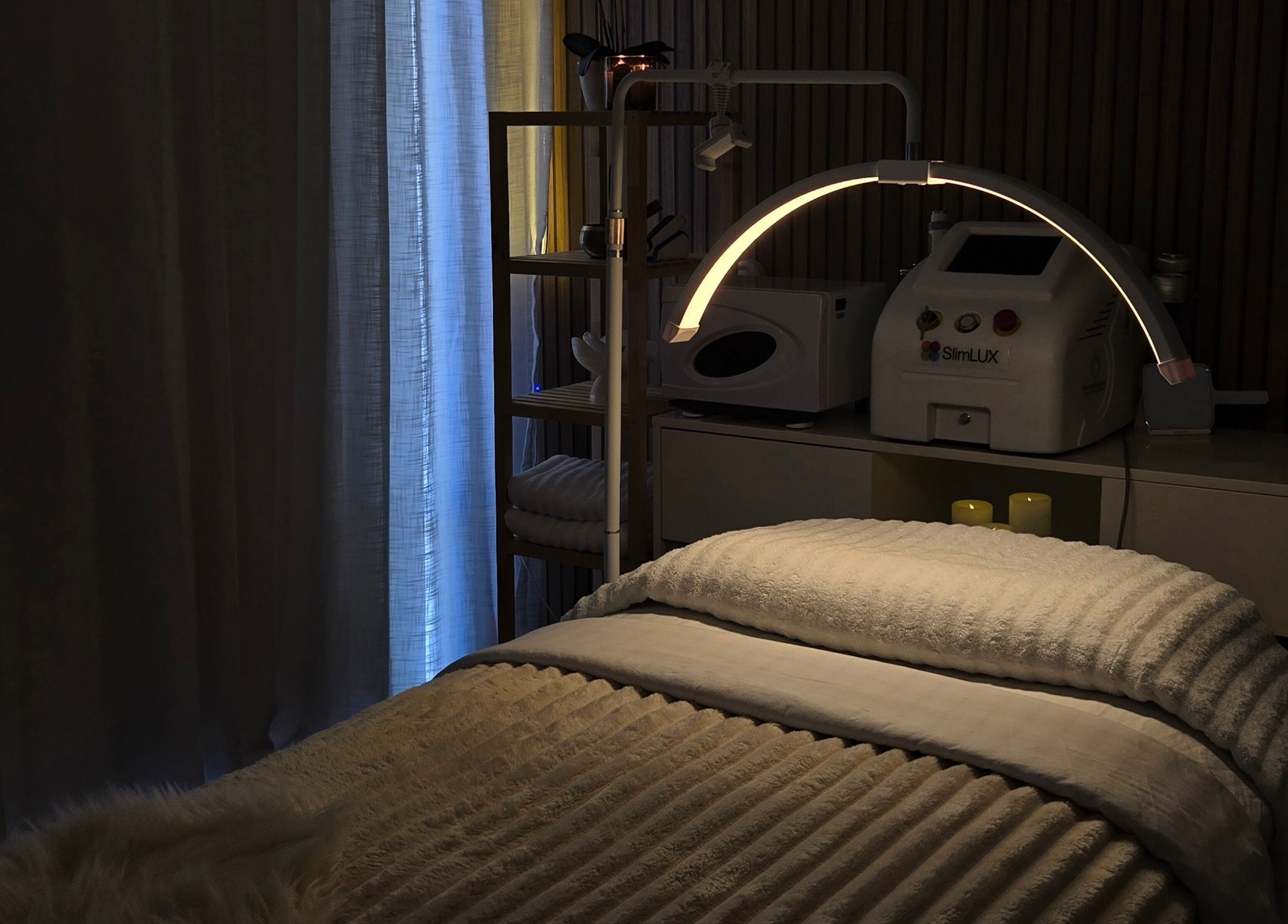 Cozy treatment room at Koda Beauty Studio in Forrestdale, Western Australia, AU with ambient lighting and equipment.