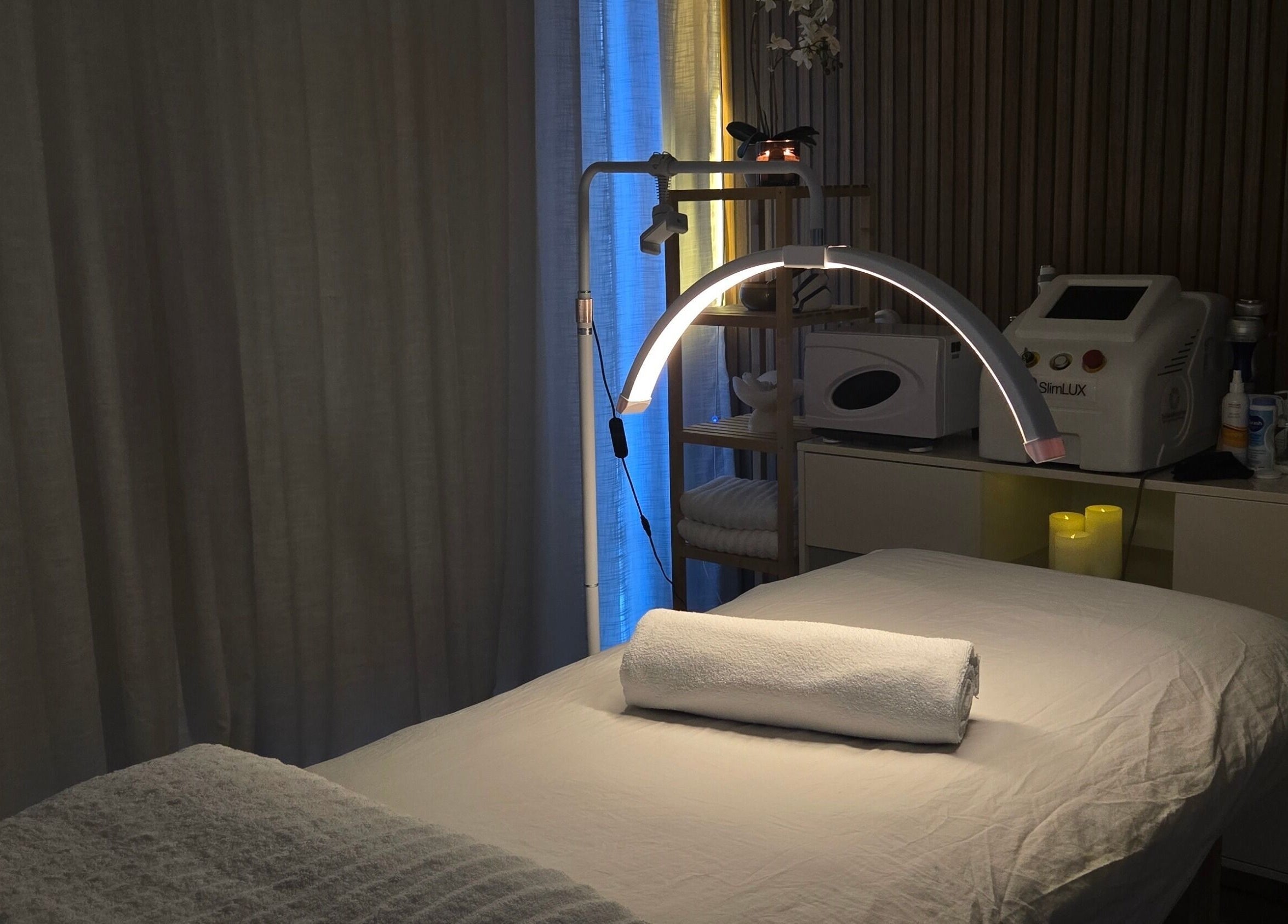 Treatment room at Koda Beauty Studio in Forrestdale, Western Australia, AU, featuring a bed and ambient lighting.