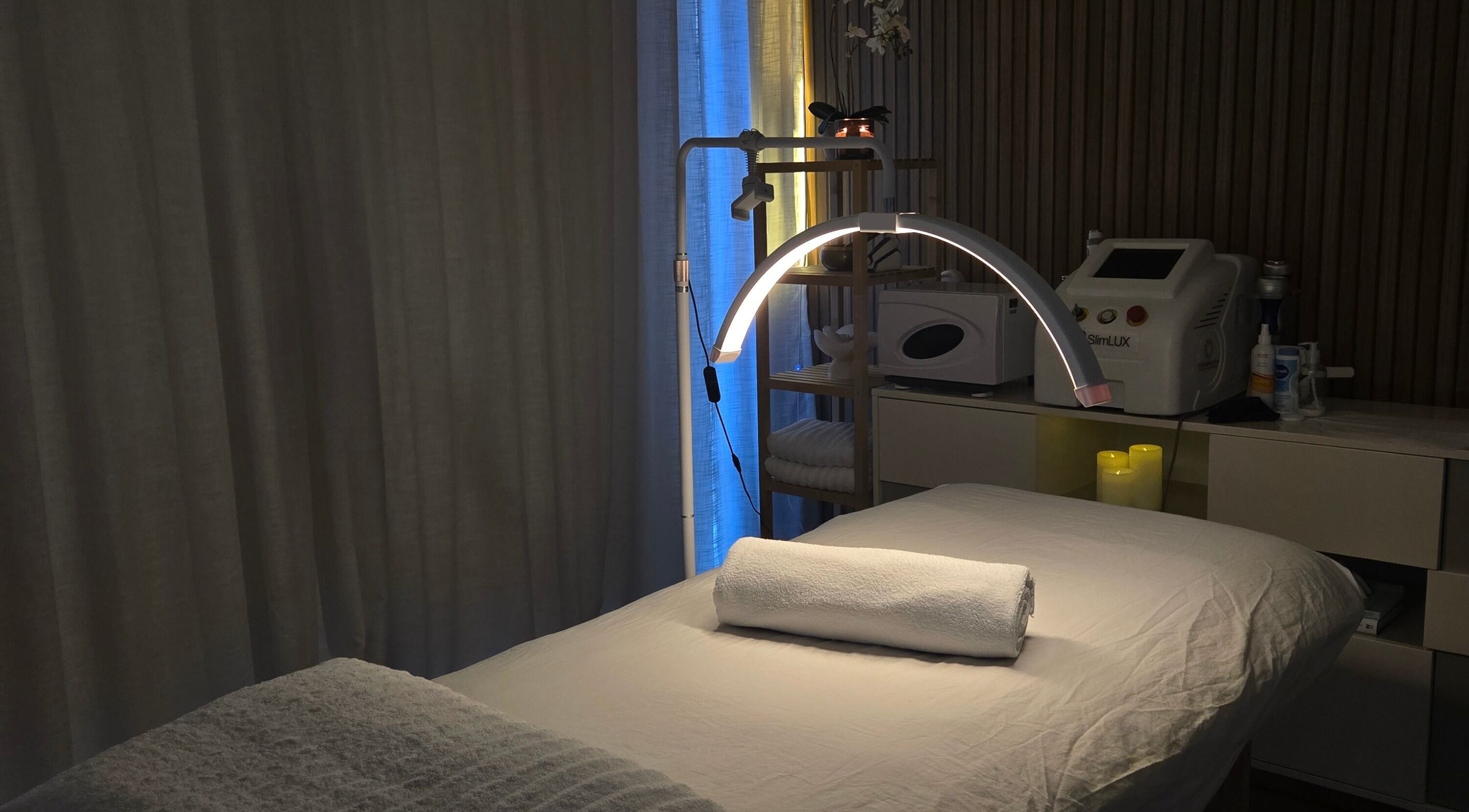 Treatment room at Koda Beauty Studio in Forrestdale, Western Australia, AU, featuring a bed and ambient lighting.
