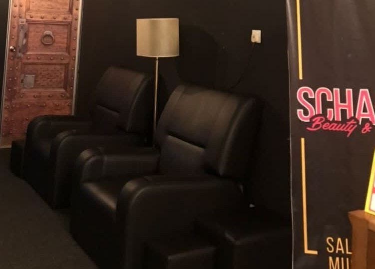 Black leather chairs and signage at Schada Beauty and Spa, Johor Bahru, Johor, MY offer a tranquil atmosphere.