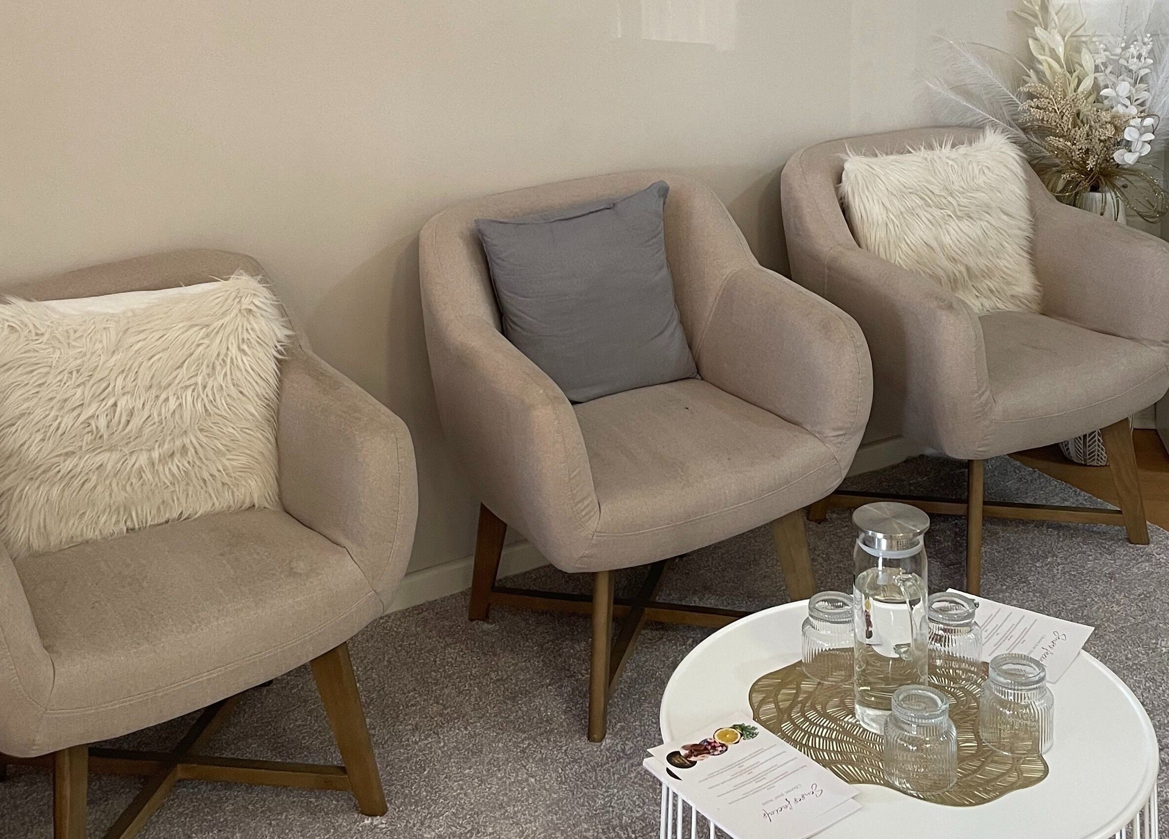 Plush seating area at The Skin Edit - Wanneroo, Wanneroo, Western Australia, AU, featuring soft chairs and cushions.
