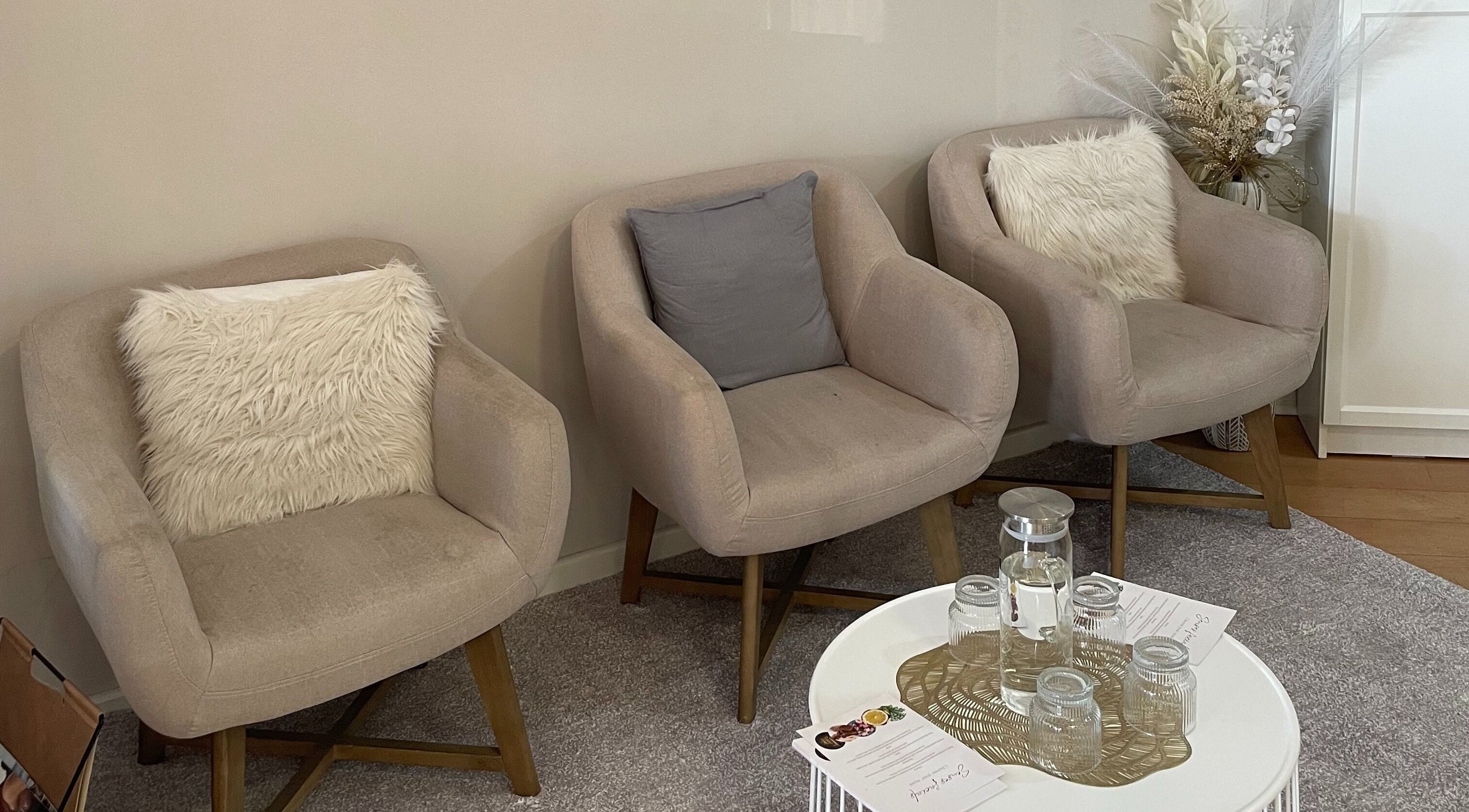 Plush seating area at The Skin Edit - Wanneroo, Wanneroo, Western Australia, AU, featuring soft chairs and cushions.