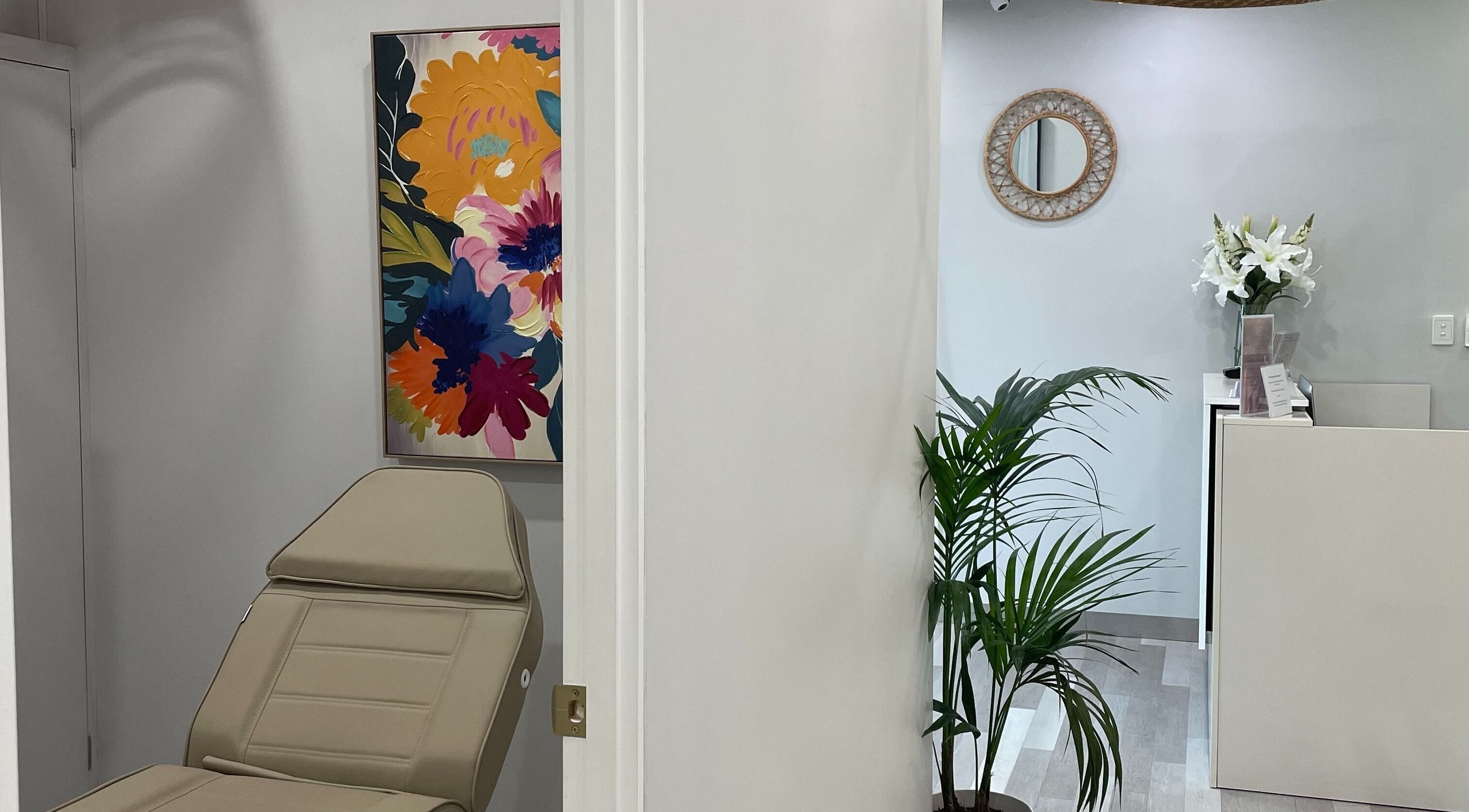 Relaxing interior of The Skin Edit - Quinns Rocks, featuring a treatment chair and floral art in Quinns Rocks, Western Australia, AU.