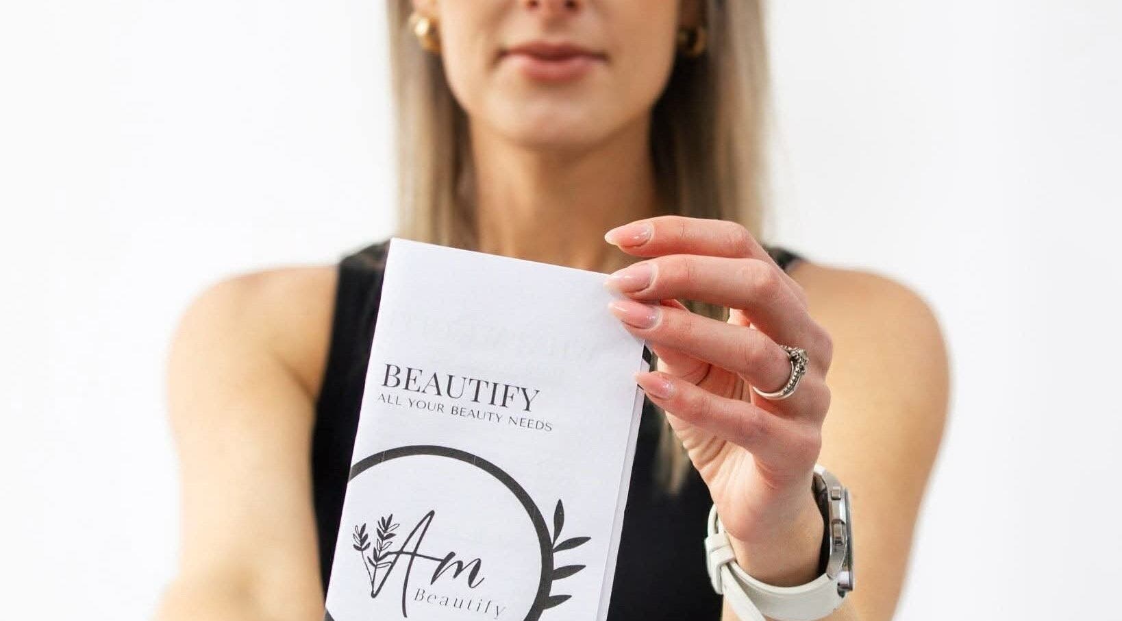 Woman holding an Am Beautify brochure, Benoni, Gauteng, ZA. Elegant beauty marketing.