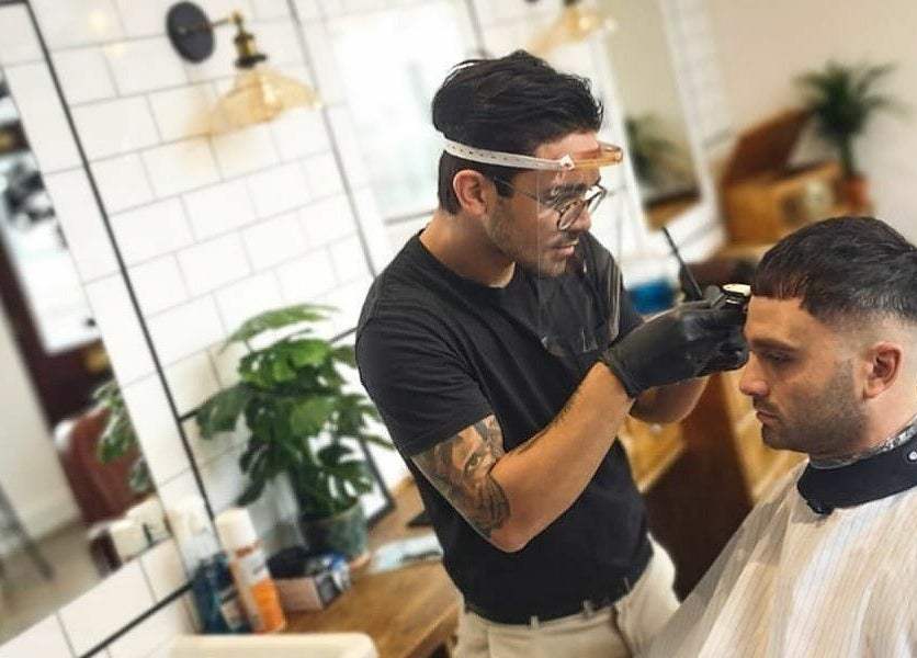 Barber styling at Asylum287, Barrow-in-Furness, England, GB. Professional grooming in a modern setting.