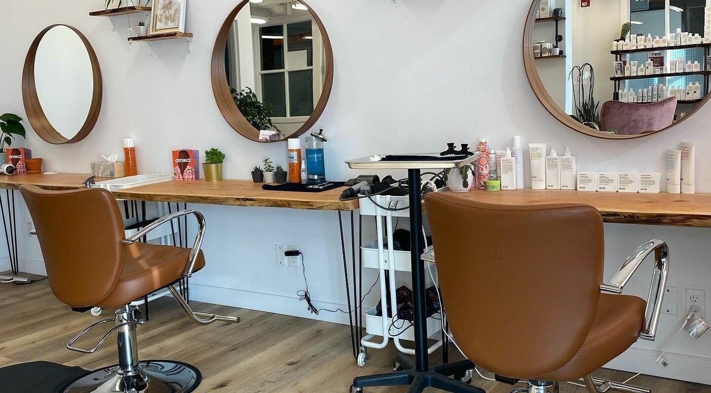 Stylish salon chairs and mirrors at Lighthouse Hair in Canmore, Alberta, CA.