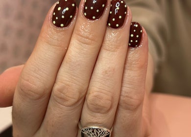 Elegant polka dot nail art at Get Nails & Lashes, Whittlesey, GB.