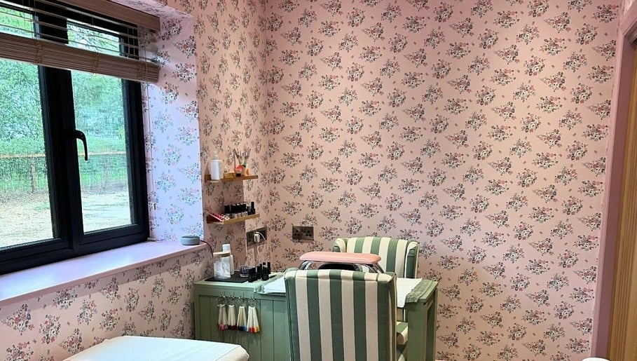 Cozy nail salon with floral wallpaper at Get Nails & Lashes, Whittlesey, GB.