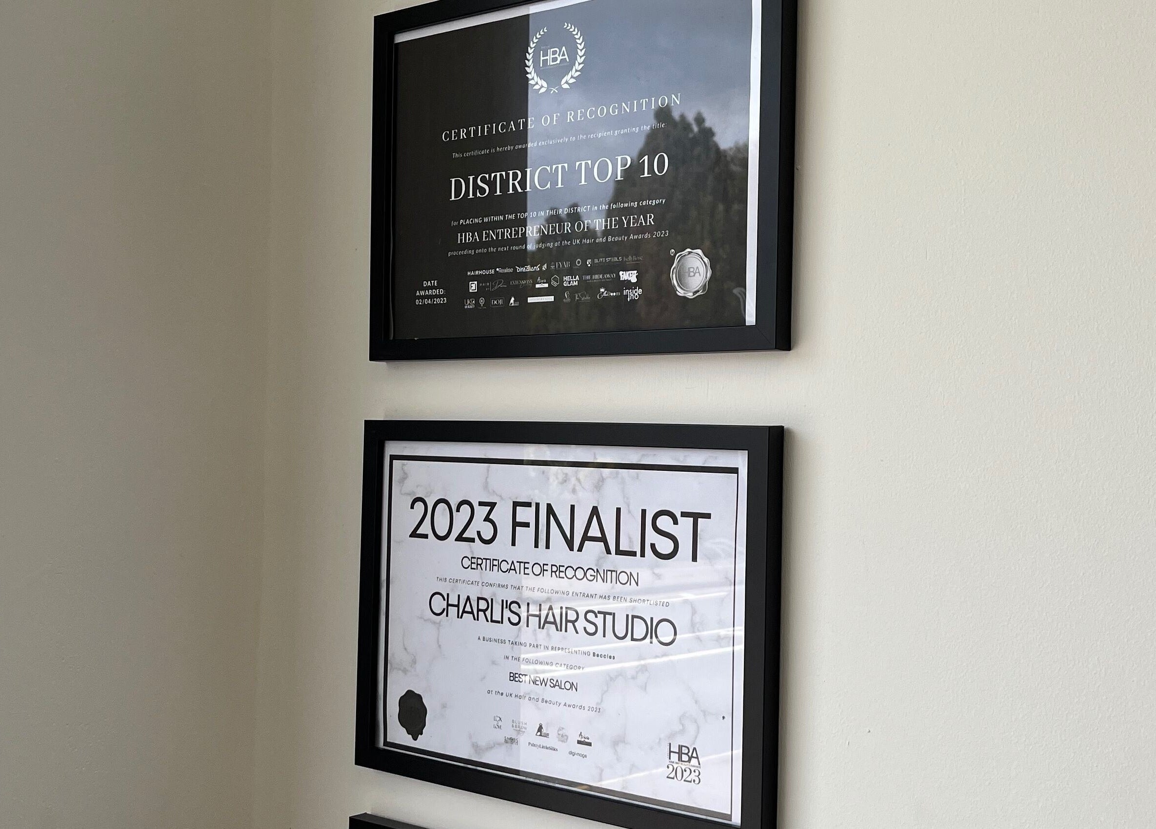 Award certificates displayed on the wall at Charli's Hair Studio in Beccles, England, GB.