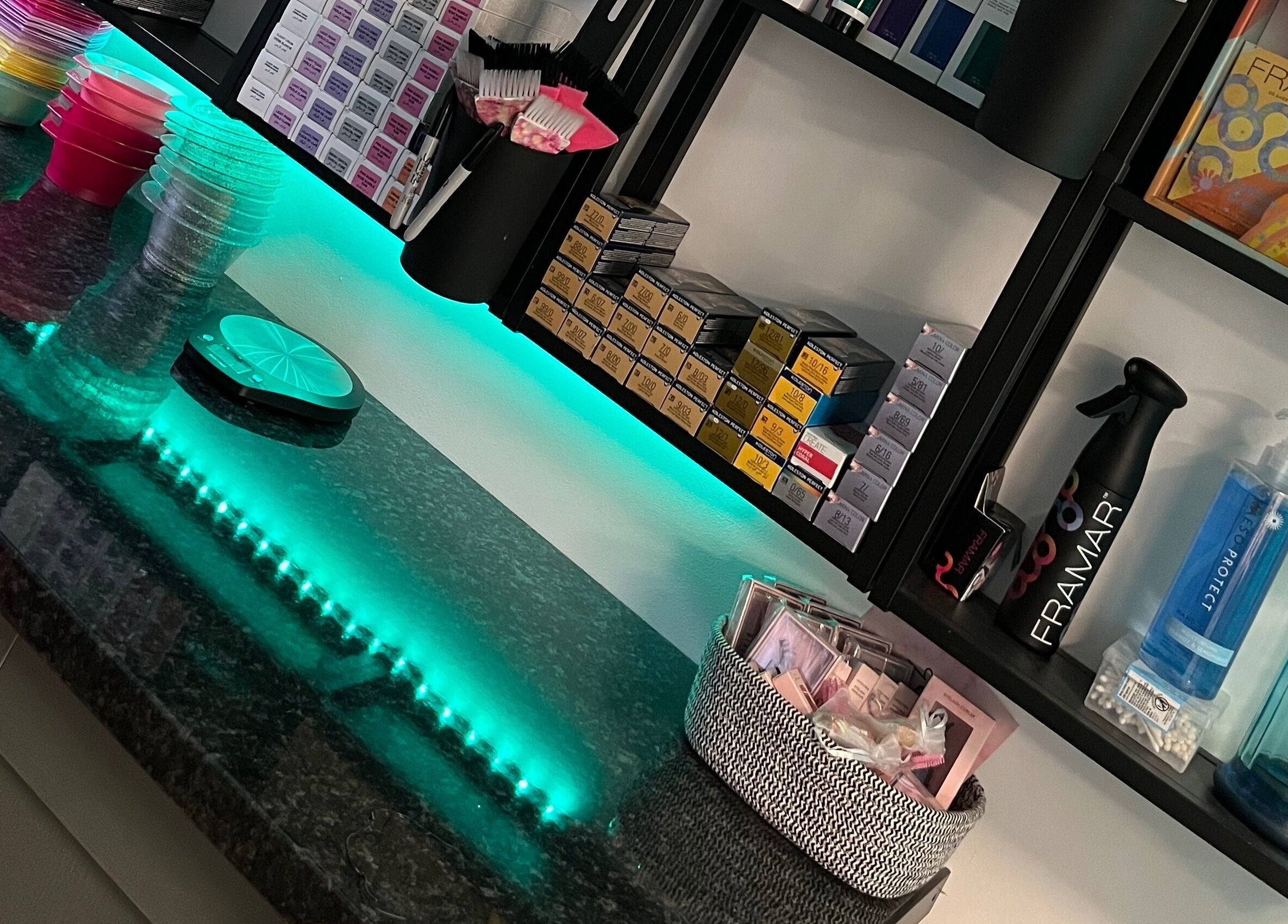 Charli's Hair Studio in Beccles, England. A vibrant workspace with organized salon tools and creative lighting.