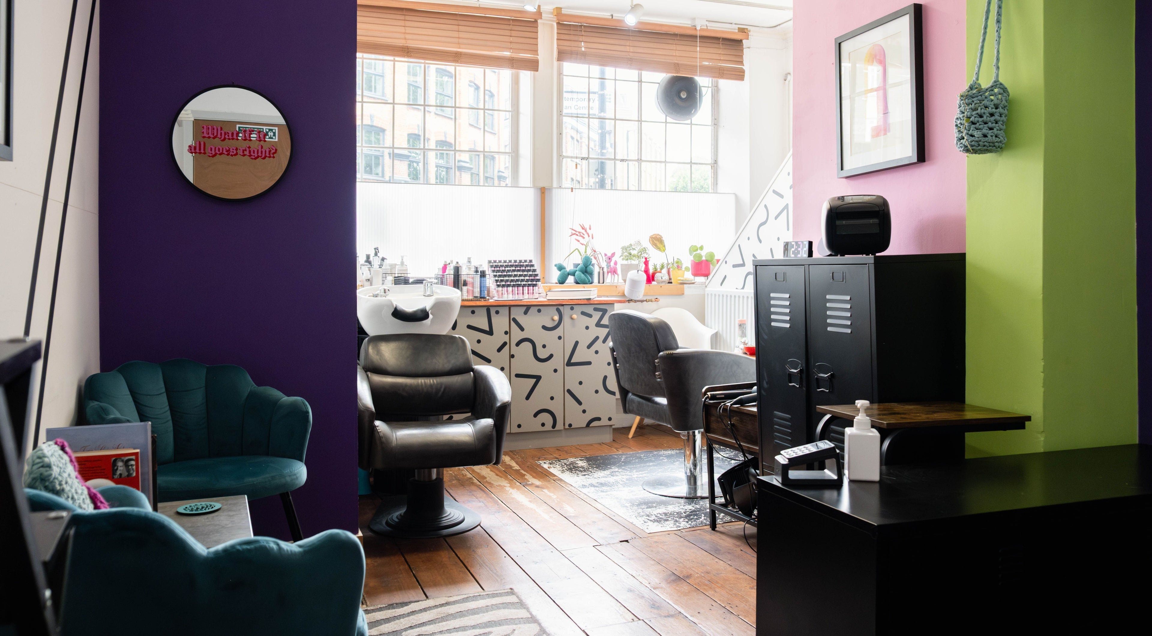 Stylish interior of Elbie van Eeden Hair, London, England, GB, featuring salon chairs and modern decor.