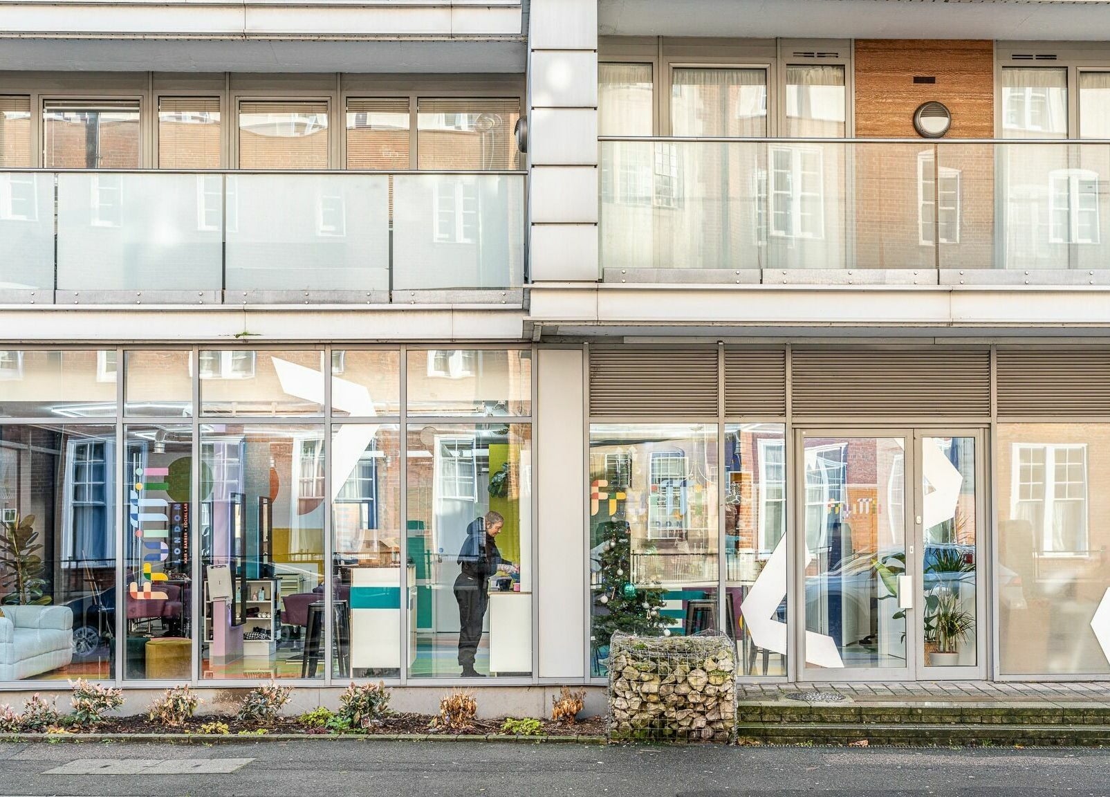 Street view of Fruittii London, featuring a modern glass facade in London, England, GB.