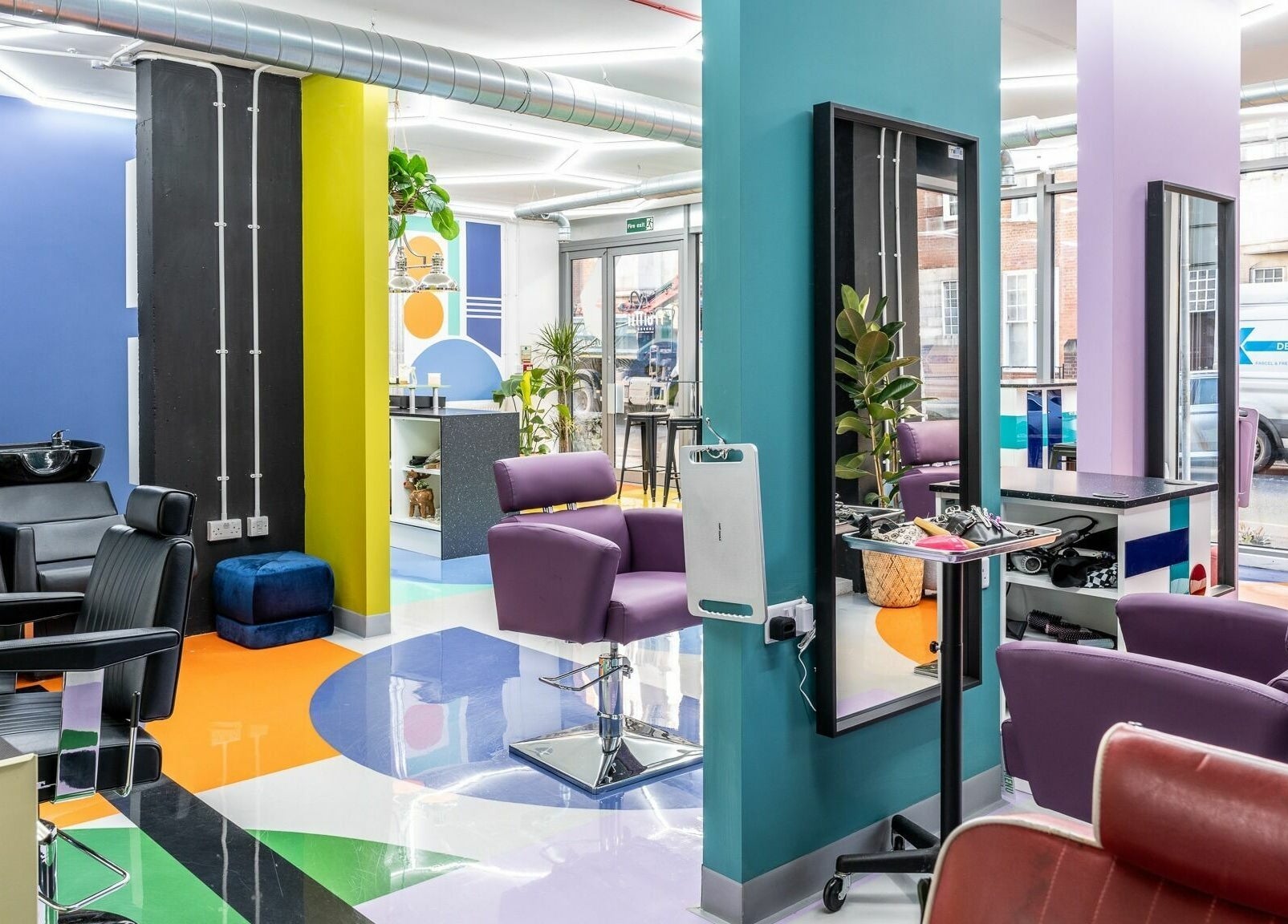 Bright, colorful interior of Fruittii London salon in London, England, GB with modern chairs and vibrant decor.