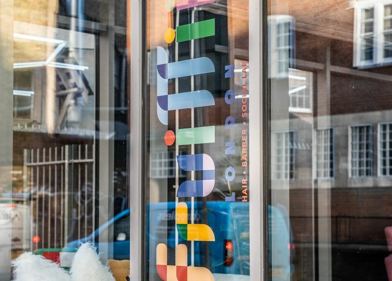 Fruittii London window display in London, England, GB showcasing modern and colorful logo.