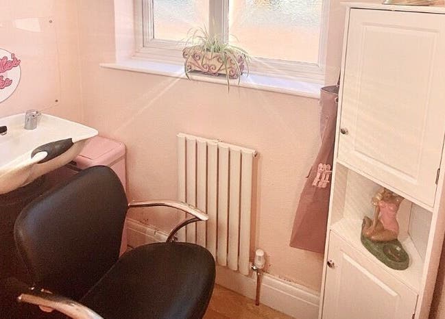 Charming hair washing station at Lucille's Locks, Long Eaton, England, GB, with modern amenities.