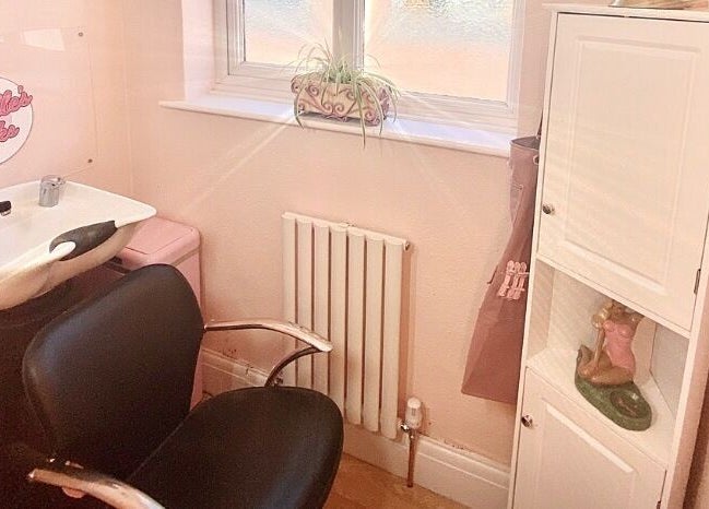 Charming hair washing station at Lucille's Locks, Long Eaton, England, GB, with modern amenities.