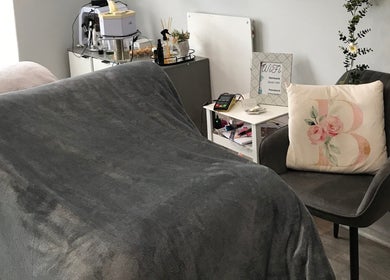 Cozy treatment room at Bali Rose Beauty Salon in Cape Town, Western Cape, ZA, with plush chair and essentials.