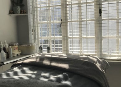 Relaxing spa treatment room at Bali Rose Beauty Salon, Cape Town, Western Cape, ZA, with natural light and products.