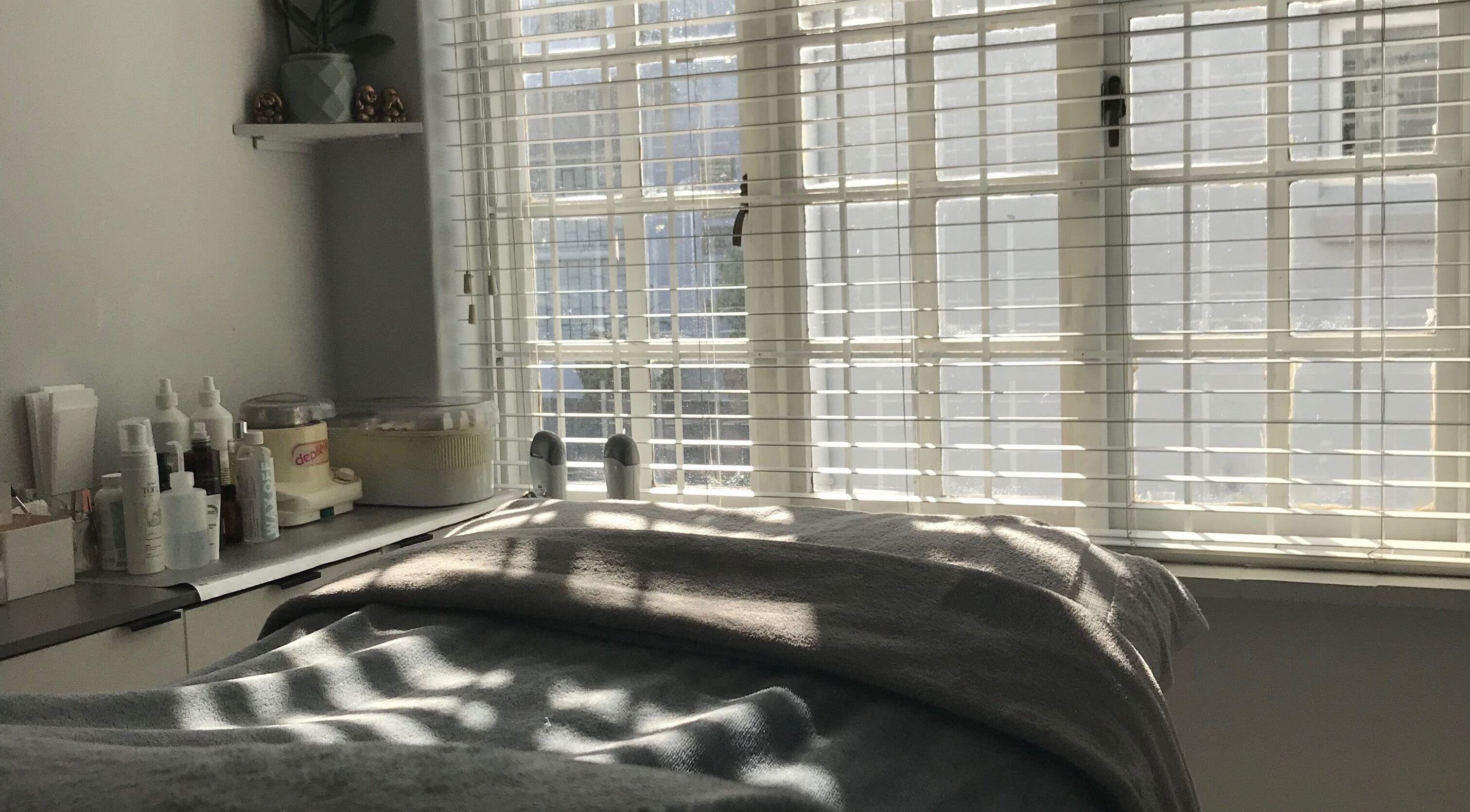 Peaceful treatment room at Bali Rose Beauty Salon in Cape Town, Western Cape, ZA adorned with sunlight.