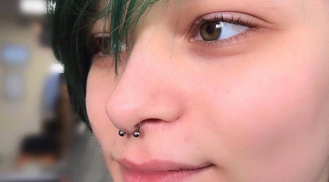 Close-up of a stylish nose piercing at Samsara Studio, Folkestone, England, GB enhancing unique facial style.