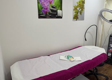 Calming treatment room setup at Claudia's Hair And Beauty, Grays, England, GB, featuring a massage table.