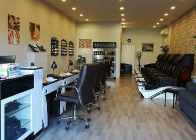 Bright interior of Rio Beauty in Napier, Hawke's Bay, NZ with stylish chairs and decor.