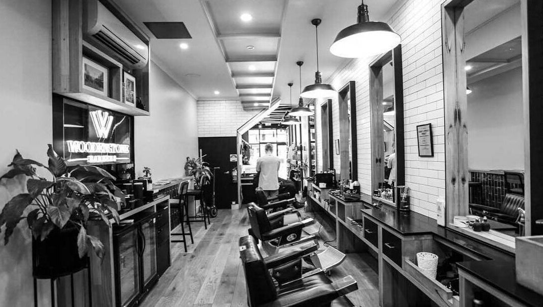 Elegant interior of Woodenstone Barbers, Byron Bay, New South Wales, AU with classic barber chairs and stylish decor.