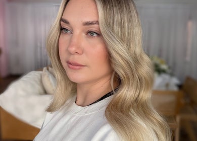 Woman with wavy blonde hair at La Lars Hair, Maryborough, Queensland, AU.