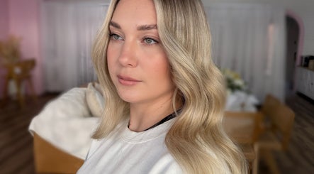 Woman with wavy blonde hair at La Lars Hair, Maryborough, Queensland, AU.