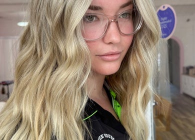 Stylish blonde wavy hairstyle at La Lars Hair in Maryborough, Queensland, AU.