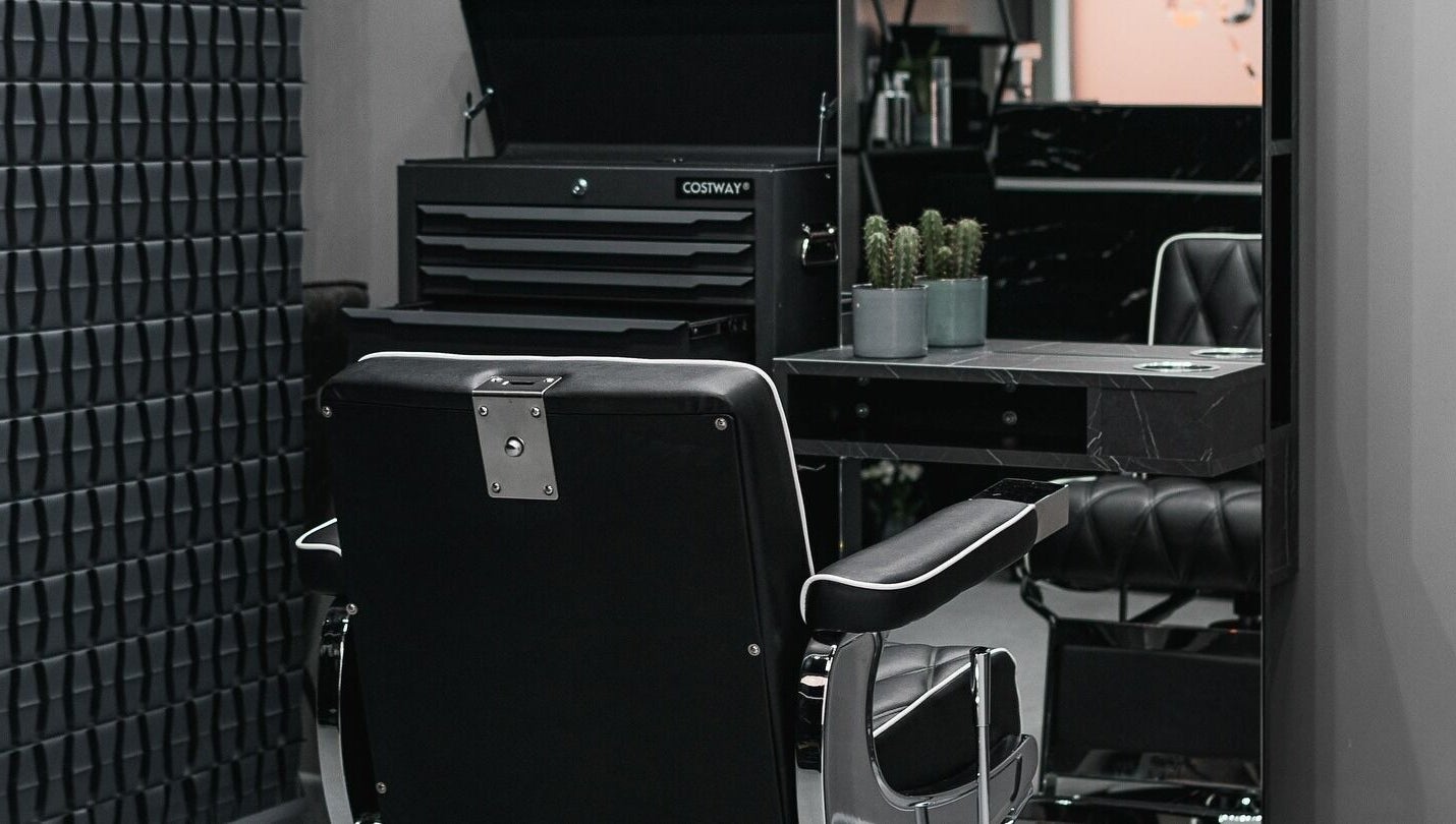 Chic barber chair and sleek decor at Collab Cuts, Lanark, Scotland, GB highlighting modern salon vibe.