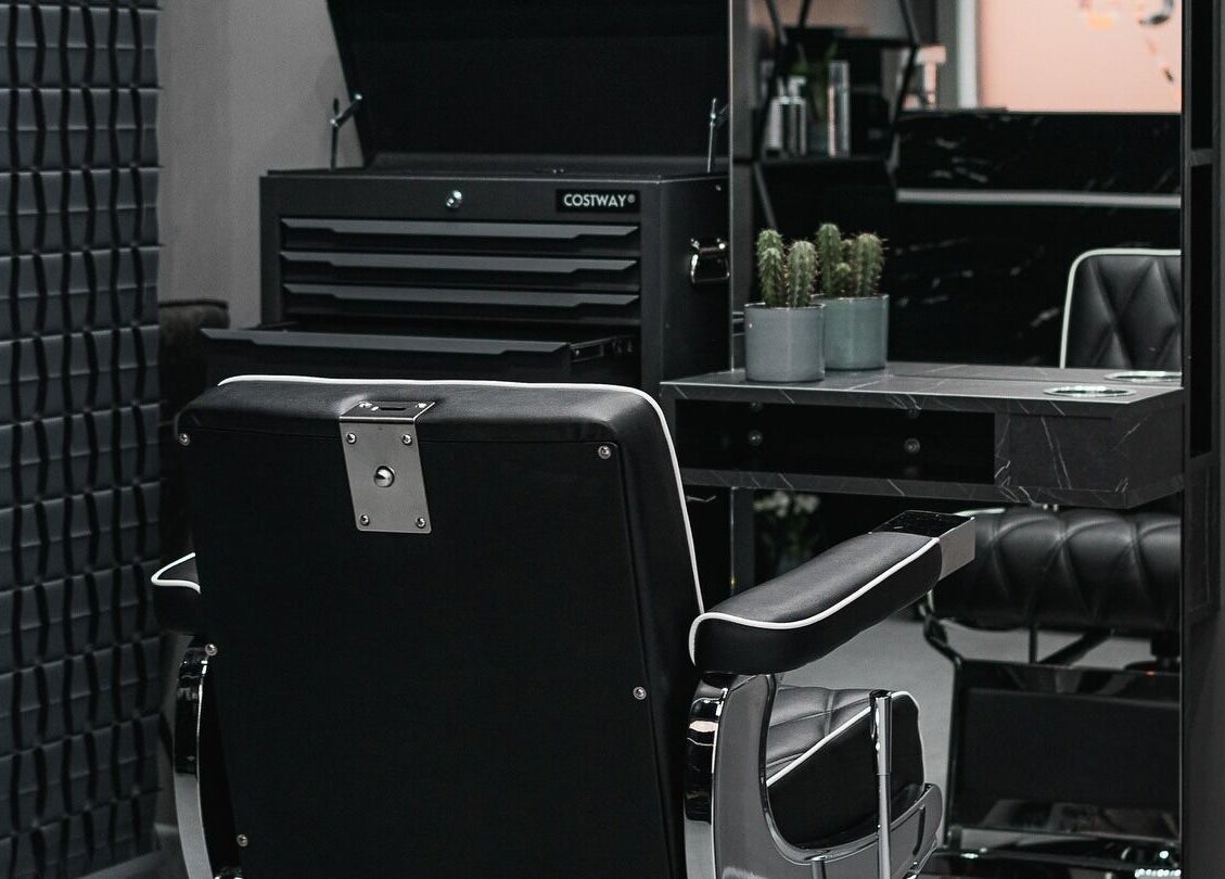 Chic barber chair and sleek decor at Collab Cuts, Lanark, Scotland, GB highlighting modern salon vibe.