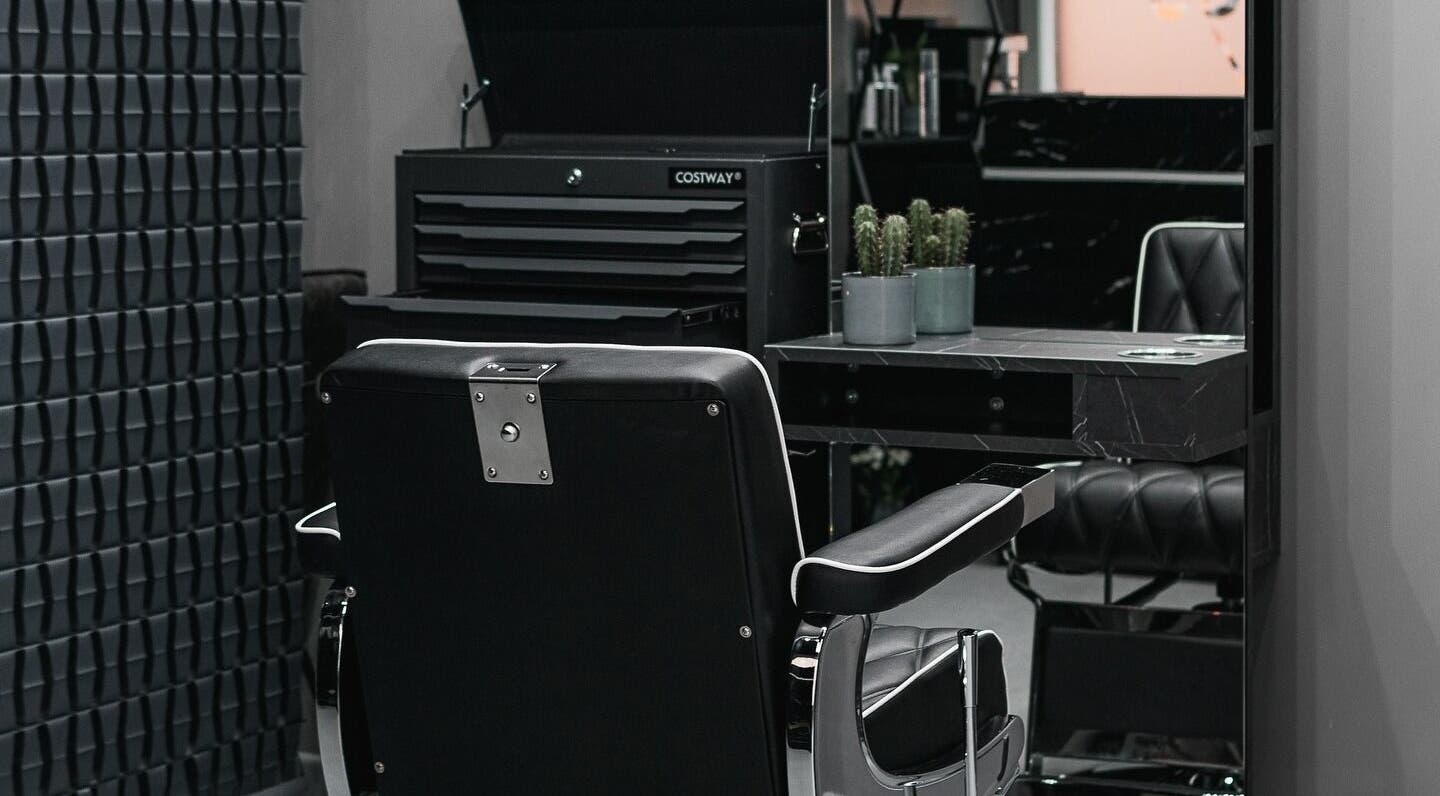 Chic barber chair and sleek decor at Collab Cuts, Lanark, Scotland, GB highlighting modern salon vibe.