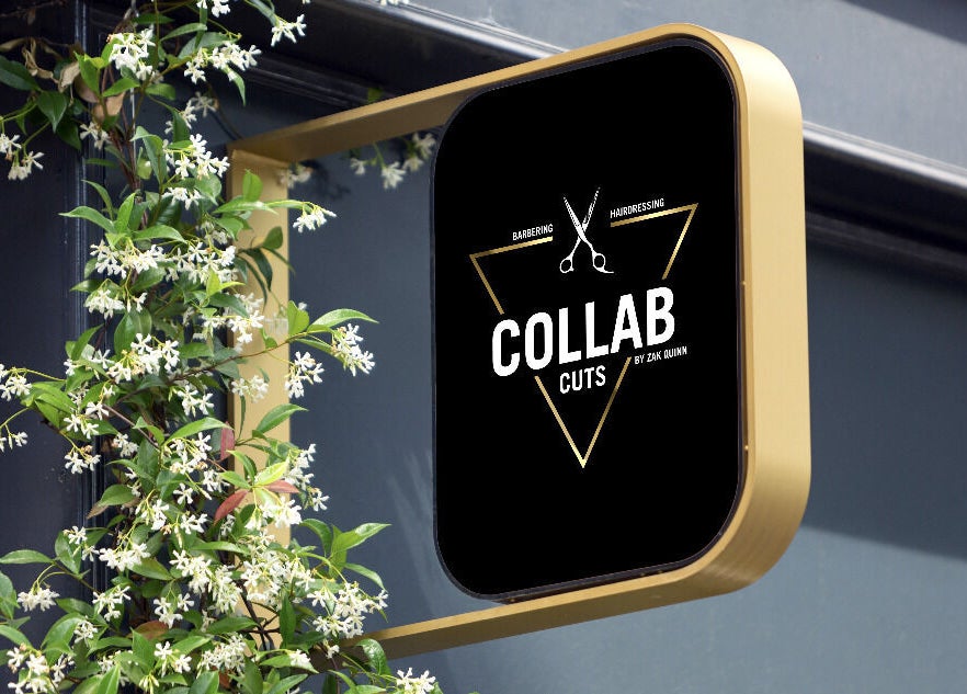 Exterior sign of Collab Cuts with floral decor, Lanark, Scotland, GB.