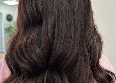 Glossy brunette waves styled at Danielle Dunn Hairstylist & Extensionists, Motherwell, Scotland, GB.