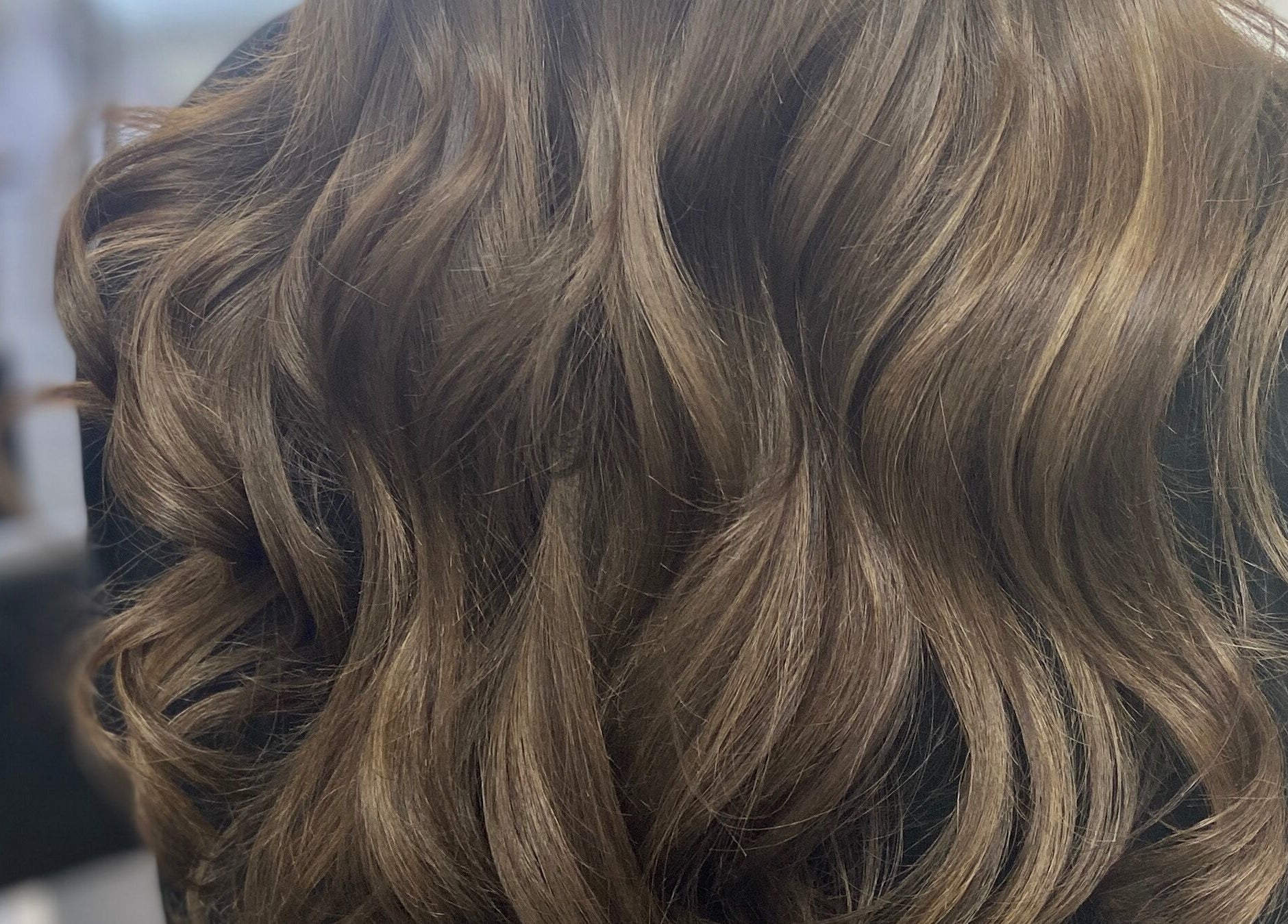 Elegant wavy hairstyle by Danielle Dunn Hairstylist & Extensionists, Motherwell, Scotland, GB.