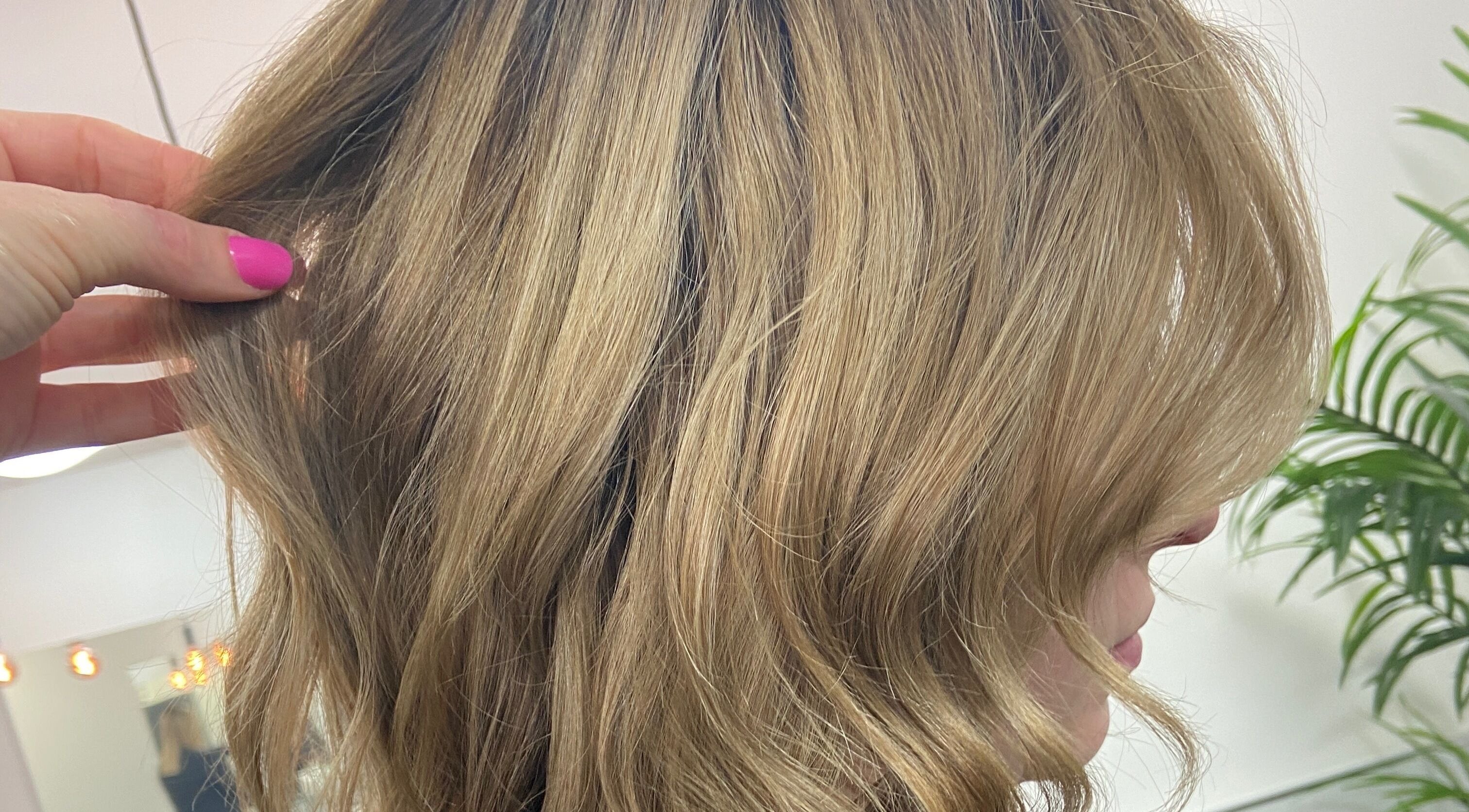 Close-up of stylish golden waves at Danielle Dunn Hairstylist & Extensionists, Motherwell, Scotland, GB.