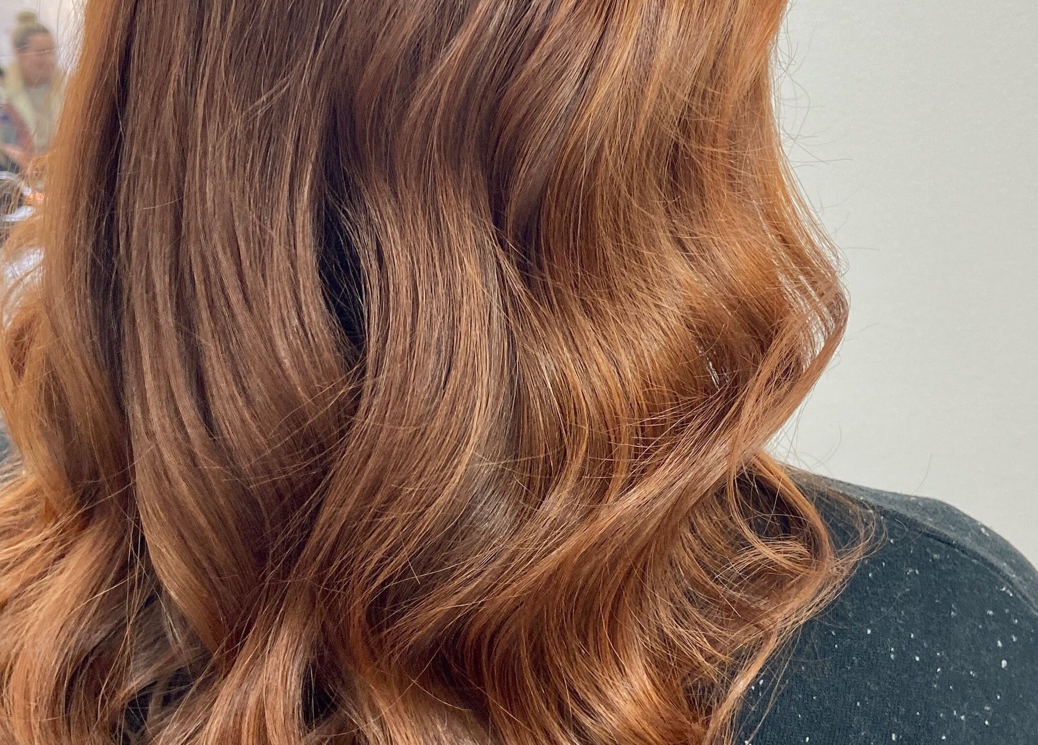 Vibrant copper waves styled at Danielle Dunn Hairstylist & Extensionists, Motherwell, Scotland, GB.
