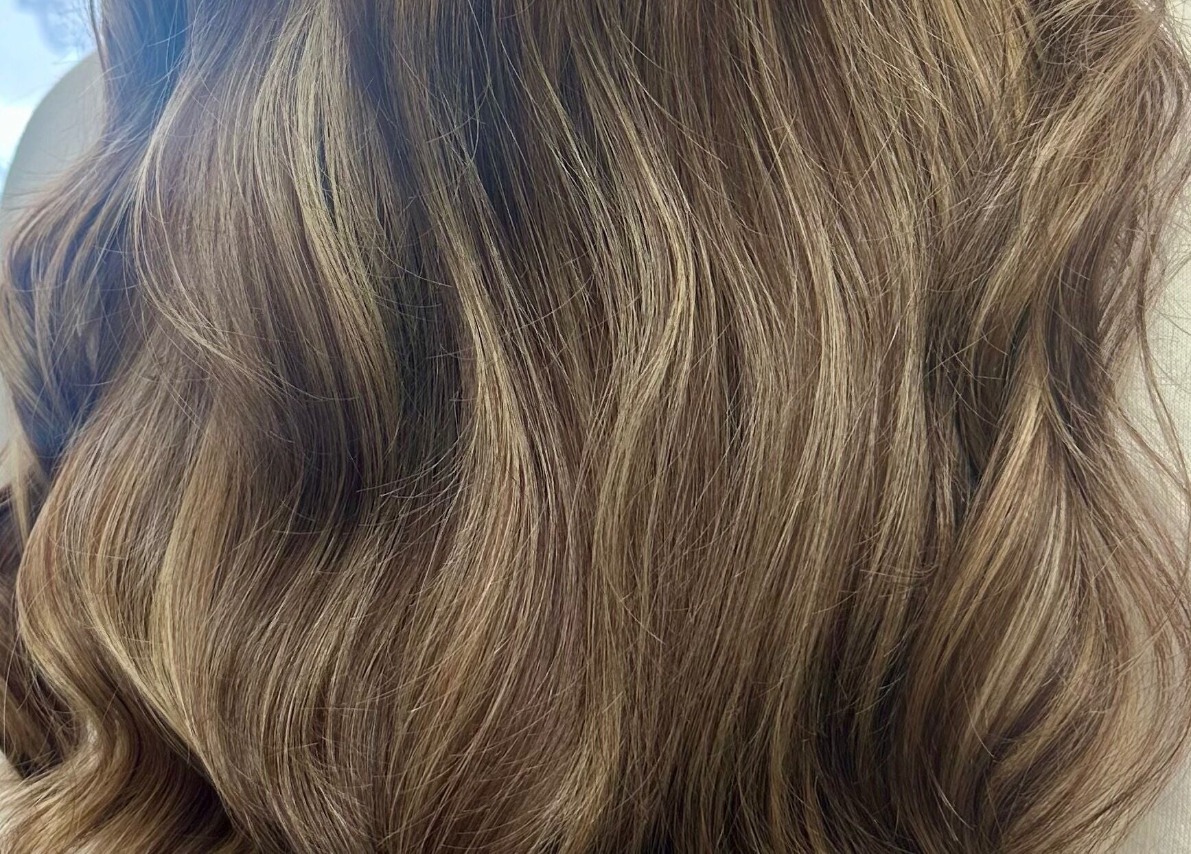 Elegant wavy hairstyle crafted at Danielle Dunn Hairstylist & Extensionists in Motherwell, Scotland, GB.