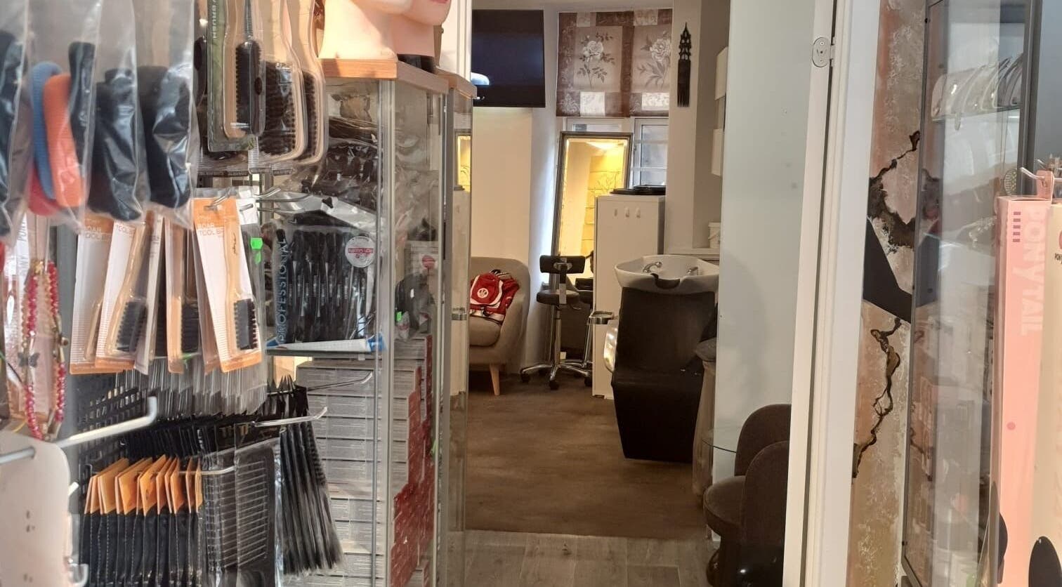 Afrohagen Salon in Frederiksberg, Denmark, showcasing hair tools and washing stations.