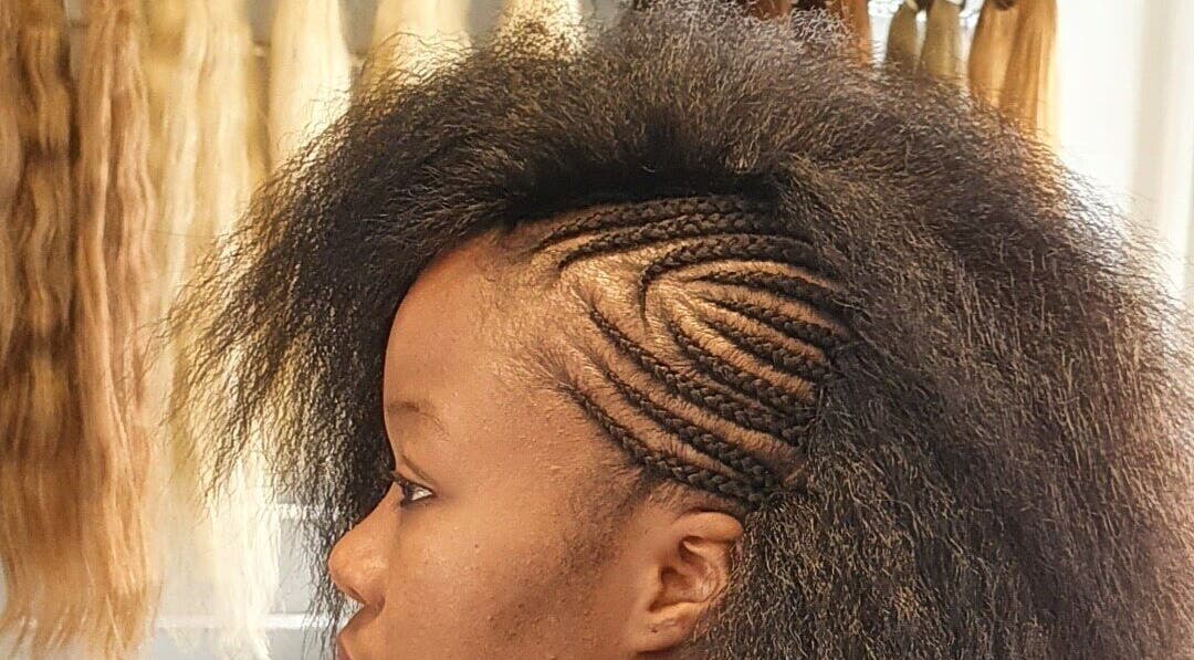 Intricate braids at Afrohagen Salon and Kosmetik, Frederiksberg, Denmark, DK showcasing skilled hairstyling.