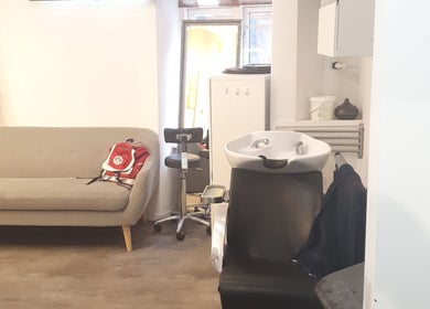 Cozy salon interior at Afrohagen Salon and Kosmetik, Frederiksberg, Denmark, DK with seating and washing station.