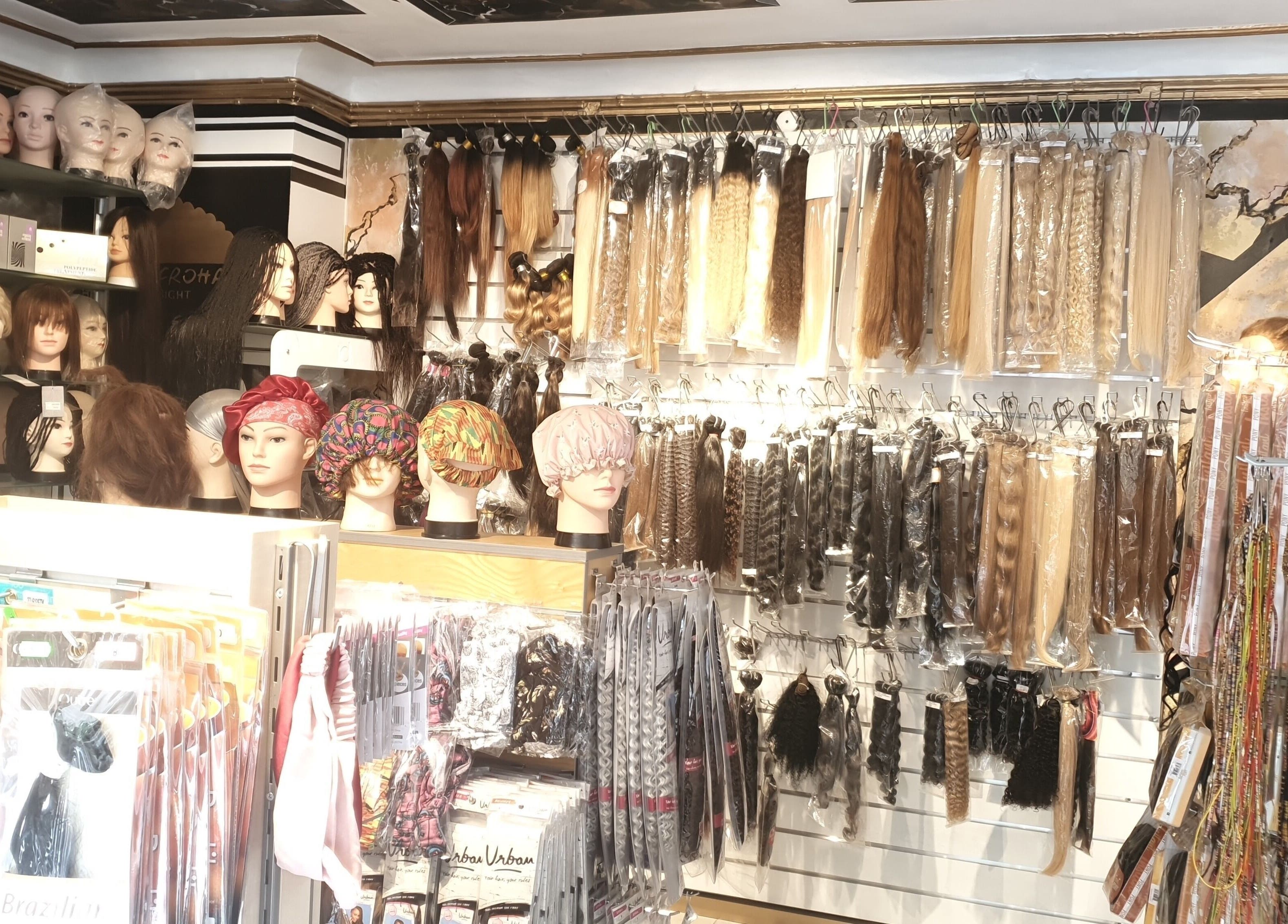 Diverse wigs and hairpieces on display at Afrohagen Salon and Kosmetik, Frederiksberg, Denmark, DK.