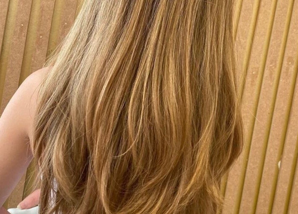 Lustrous blonde hair at Cabello salon, Birstall, England, GB showcases detailed highlights and expert styling.