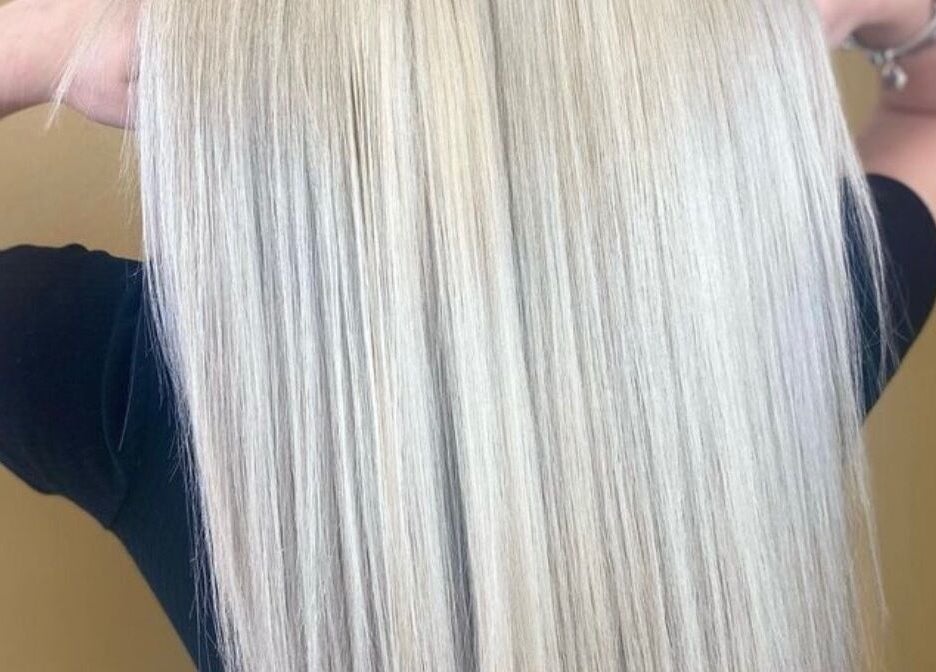 Sleek blonde hair styled at Cabello, Birstall, England, GB. Perfectly straightened for a luxurious finish.