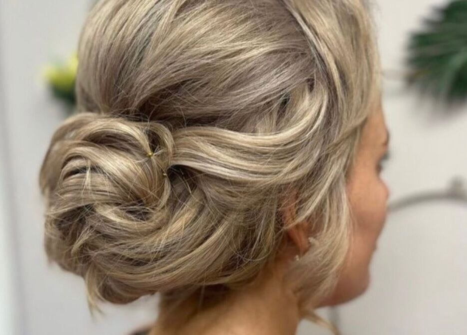 Elegant updo hairstyle at Cabello in Birstall, England, GB, showcasing intricate hair design.