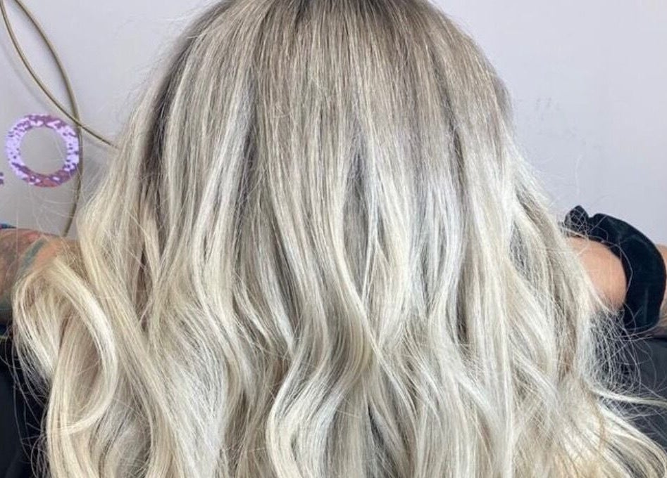 Blonde wavy hairstyle at Cabello salon in Birstall, England, GB showcasing expert styling.